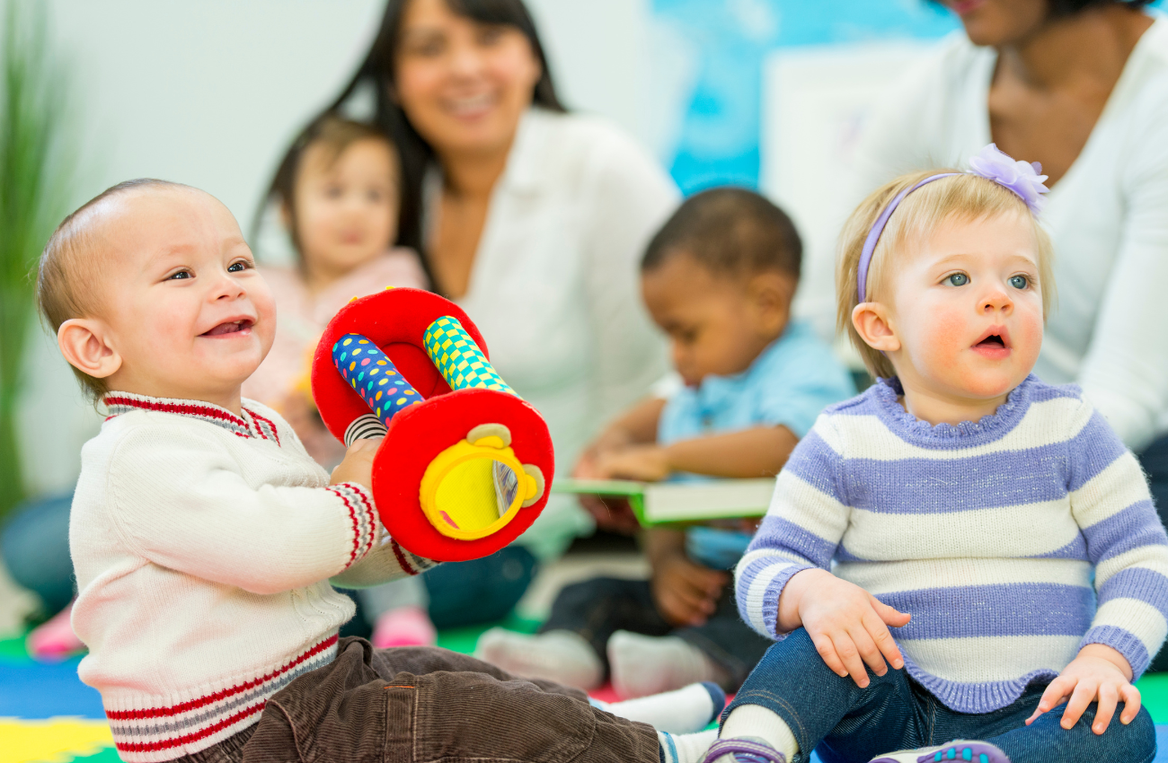 Moms and babies socialize at a playdate.