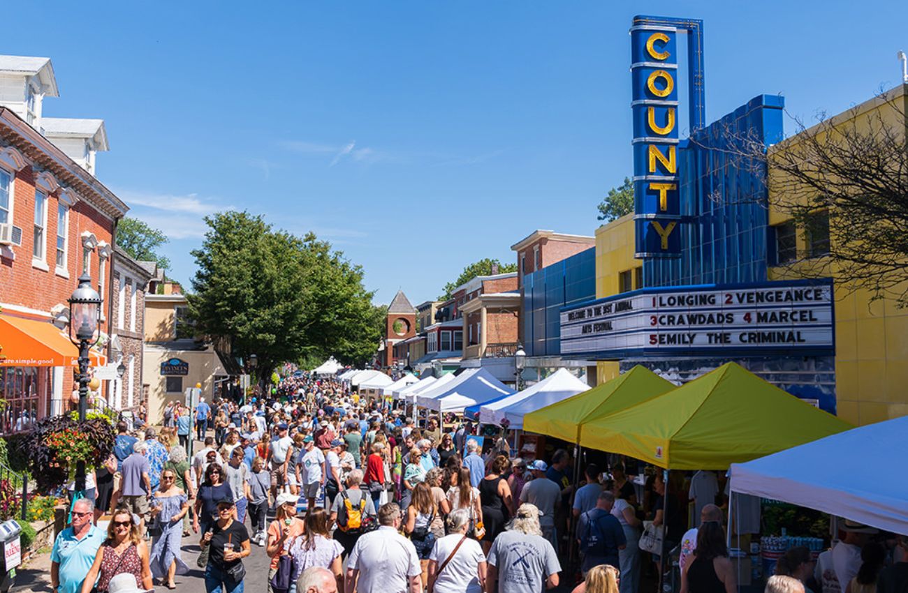 A crowded street scene on a sunny day in downtown Doylestown, PA.