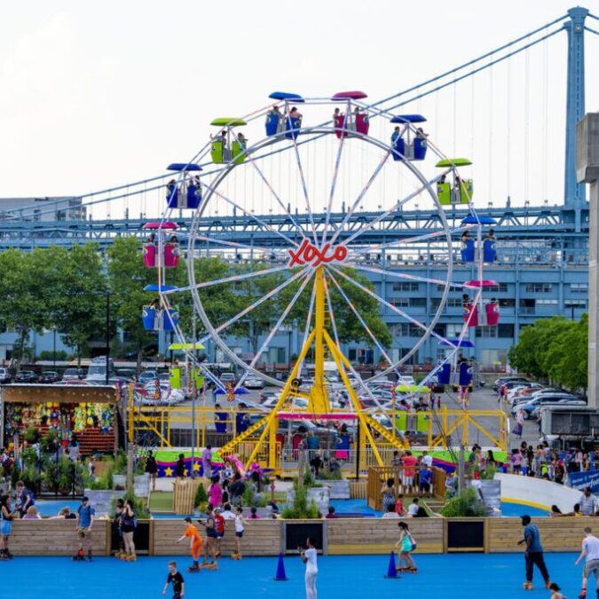 View of the Riverrink at the Delaware Waterfront in Philadelphia; roller skating and ferris wheel