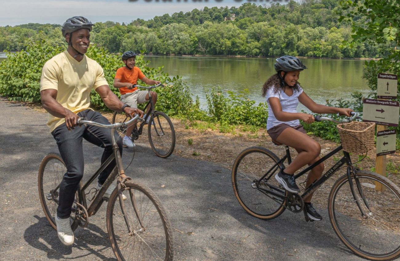 A father and two kids rides bikes along the Delaware Canal Towpath in Bucks County.