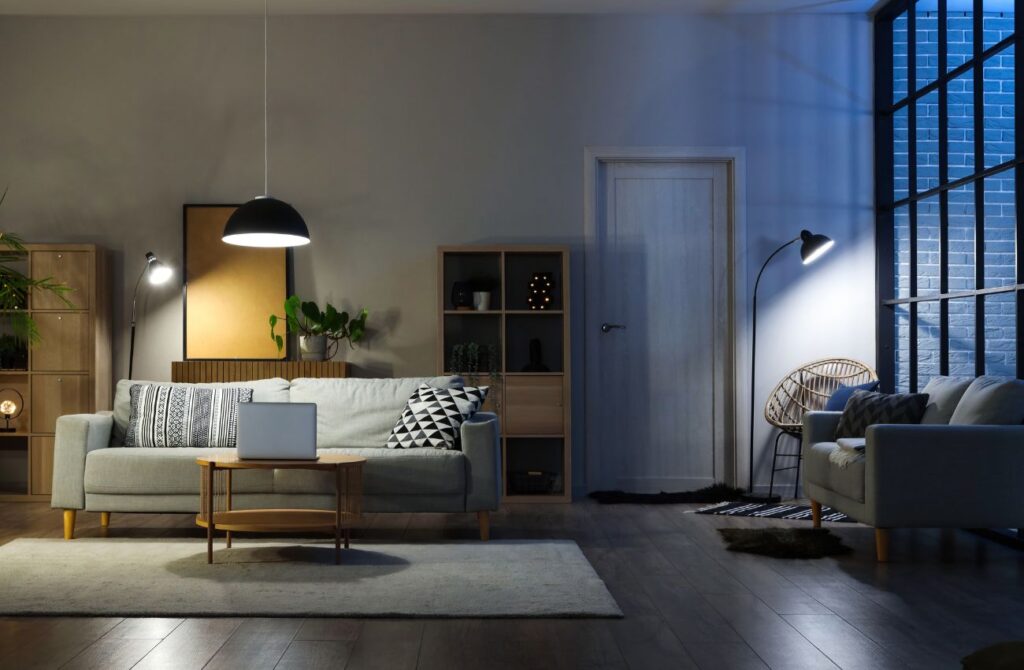 Well-placed lamps create dramatic mood lighting in a living room.