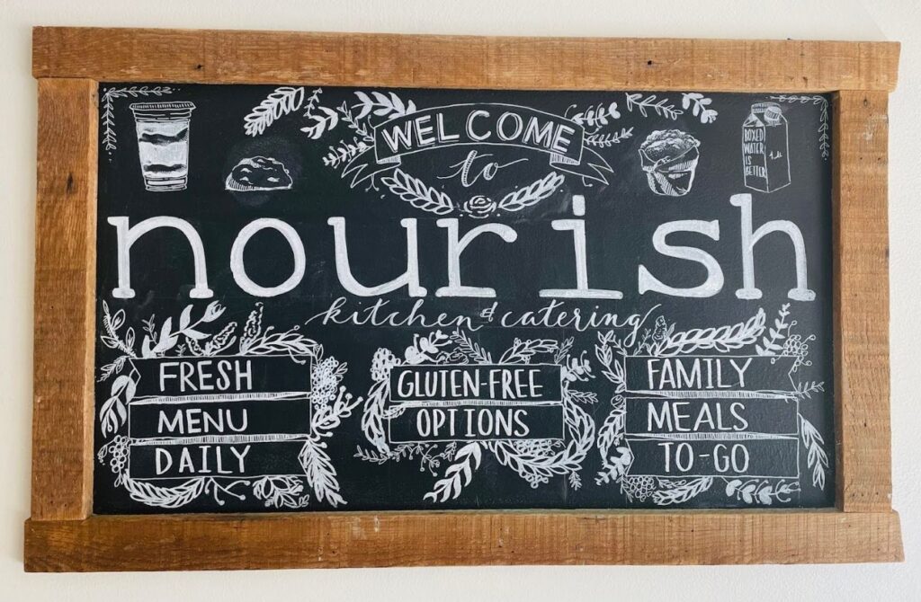 The wall sign at Nourish, a restaurant serving meals to go in Bucks County. 