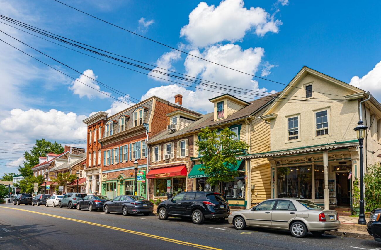 Blue skies and few clouds over a shopping street in downtown Newtown, PA.