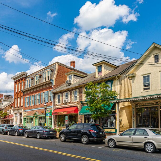 Blue skies and few clouds over a shopping street in downtown Newtown, PA.