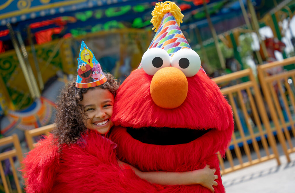 Elmo and Young Girl Celebrate Sesame Place Philadelphia's Birthday