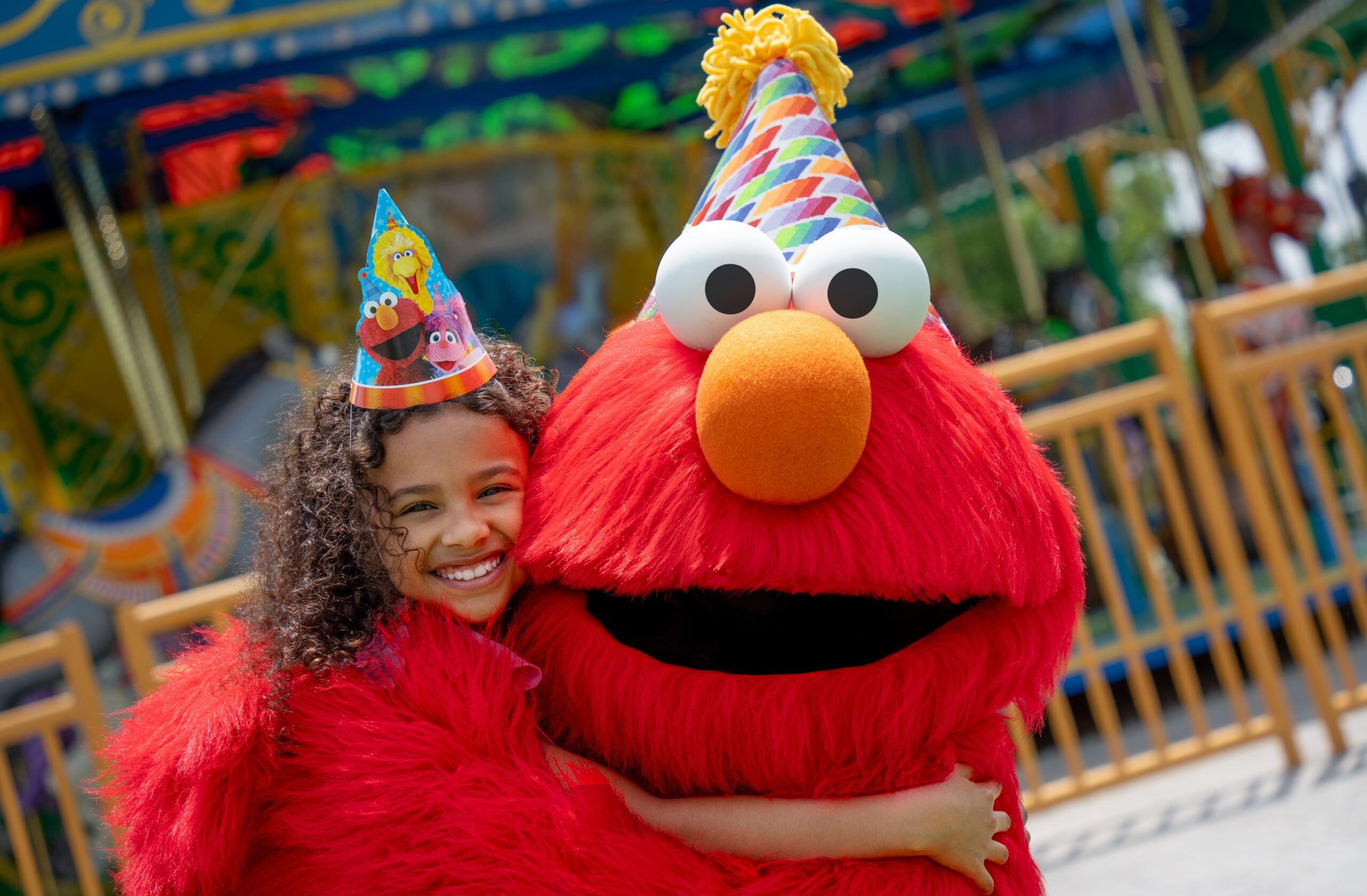 Elmo and Young Girl Celebrate Sesame Place Philadelphia's Birthday